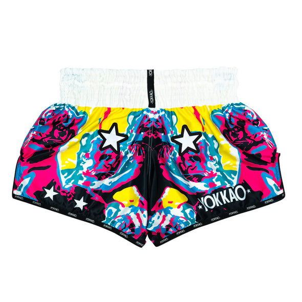 Colorful boxing shorts with star patterns and YOKKAO branding on a white background