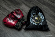 Fairtex Golden Jubilee Limited Edition Boxing Gloves with gold finish and nylon bag, premium microfiber gloves for Muay Thai, kickboxing, and boxing