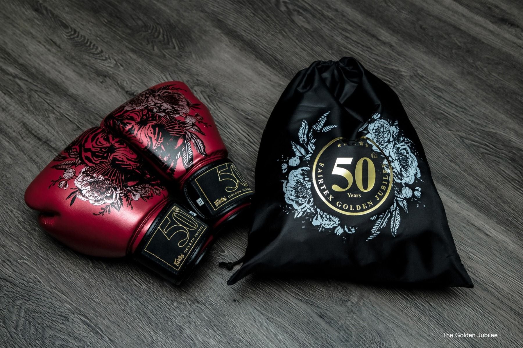 Fairtex Golden Jubilee Limited Edition Boxing Gloves with gold finish and nylon bag, premium microfiber gloves for Muay Thai, kickboxing, and boxing