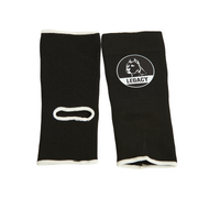 Legacy Ankle Support Guards in black, featuring the Legacy logo, designed to provide stability and protection for martial arts training.