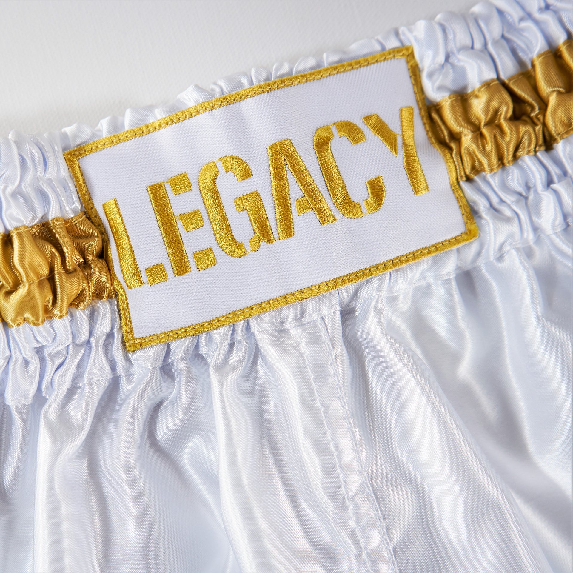 Legacy High Baller Muay Thai shorts with flashy embroidery and classic Thai boxing silhouette