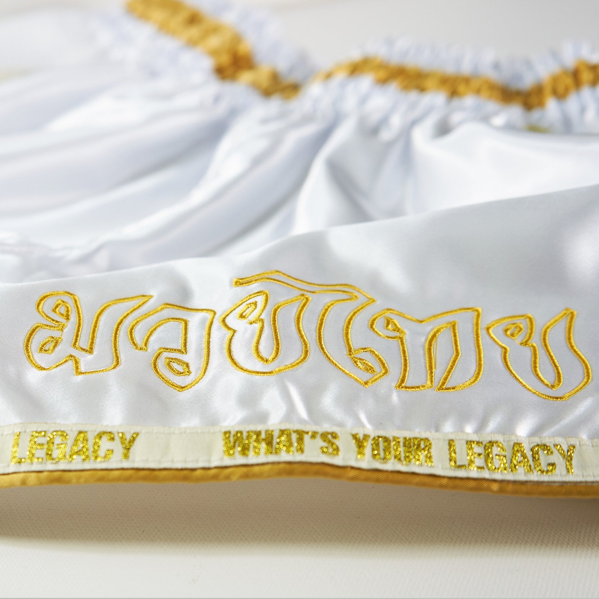 Legacy High Baller Muay Thai shorts with flashy embroidery and classic Thai boxing silhouette