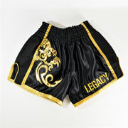 Legacy Golden Era Muay Thai shorts with traditional Thai boxing cut and gold embroidered design