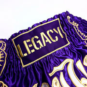 Legacy Twin Tigers Muay Thai shorts with custom embroidery and traditional Thai boxing design