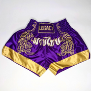 Legacy Twin Tigers Muay Thai shorts with custom embroidery and traditional Thai boxing design