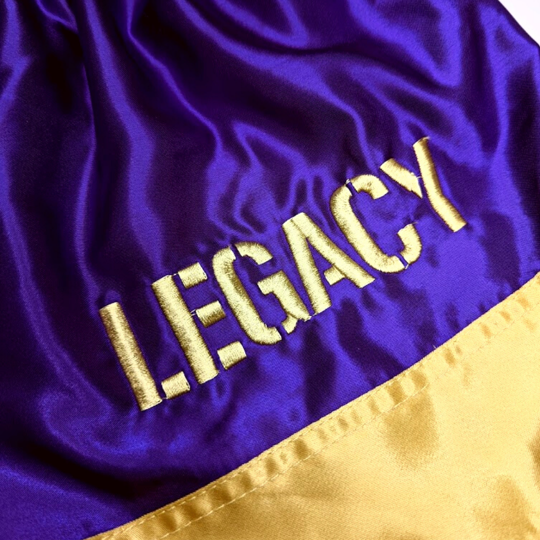 Legacy Twin Tigers Muay Thai shorts with custom embroidery and traditional Thai boxing design