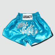 White Dragon Muay Thai shorts with embroidered dragon design and satin finish