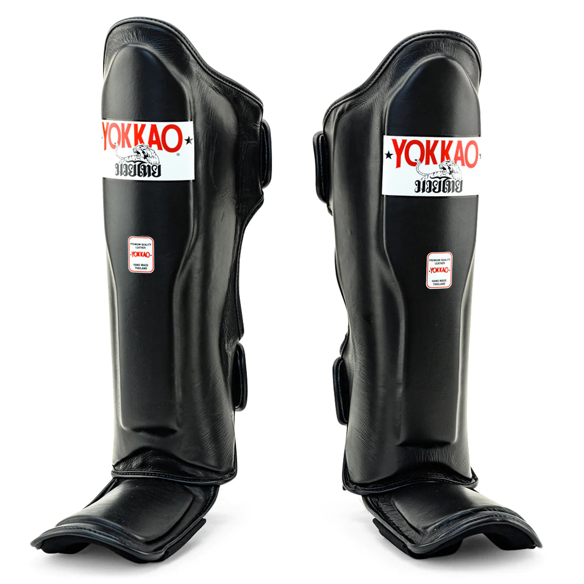 Yokkao Matrix black Muay Thai shin guards for sparring and training with double Velcro straps and premium synthetic leather