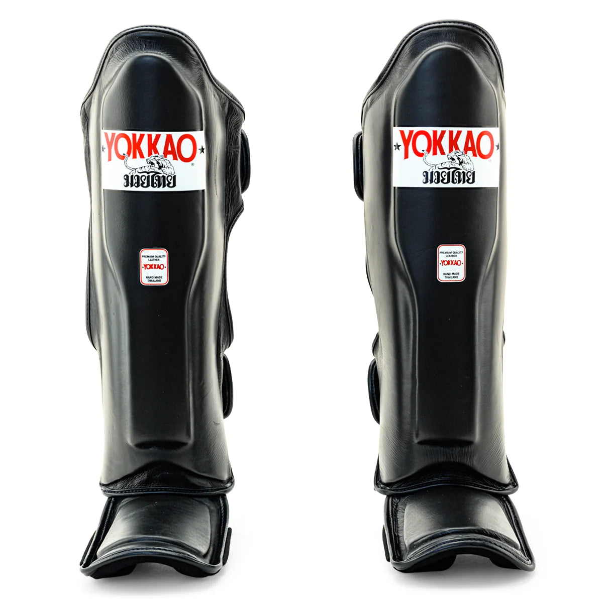 Yokkao Matrix black Muay Thai shin guards for sparring and training with double Velcro straps and premium synthetic leather