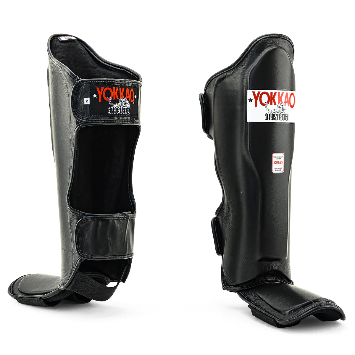 Yokkao Matrix black Muay Thai shin guards for sparring and training with double Velcro straps and premium synthetic leather